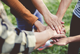 people holding their hands together